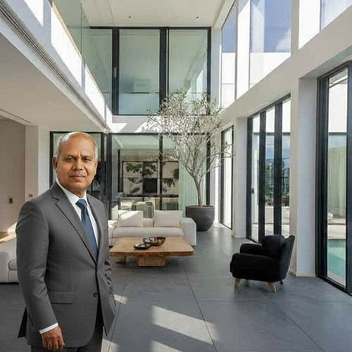 Dr. David Dharmadas, internationally recognized Vastu Consultant, inside a contemporary home designed with Vastu-compliant architecture and natural light balance.