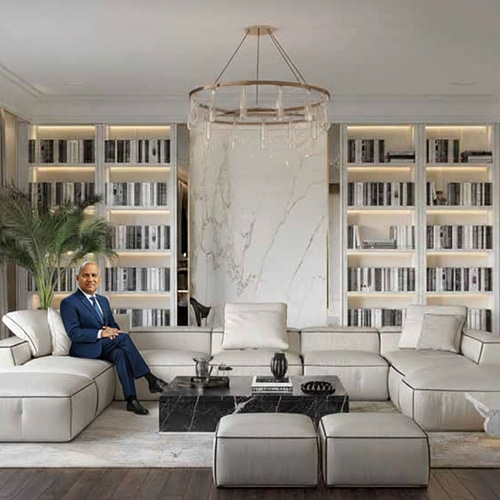 Dr. David Dharmadas seated in a Vastu-compliant luxury living space, symbolizing harmony between architectural design and cosmic balance.